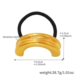 Macro view of gold curved ripple hair ring showing stainless steel texture and dimensions