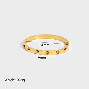 Detail showing 6mm width and 61mm inner diameter of gold-plated zircon bangle