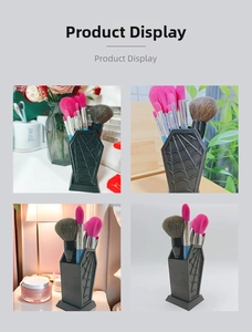 Gothic coffin-shaped makeup brush holder with detailed spider web relief for vanity decor