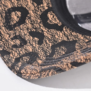Macro detail of leopard print baseball cap brim with precise stitching and fabric texture