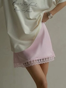 Summer pink satin skirt with delicate lace trim and printed casual t-shirt outfit