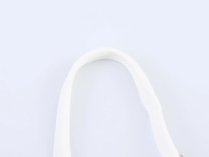 Detailed view of white canvas handle with precise stitching on vacation style dress
