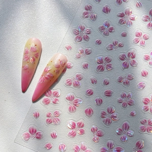 3D embossed pink cherry blossom nail stickers with iridescent shimmer on floral petal sheet