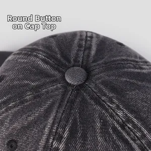 Detailed macro shot of the round top button and stitching on the washed denim baseball cap