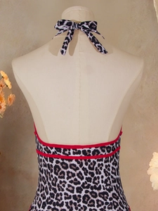 Detail of leopard print halter bikini back with adjustable straps and red trim accents