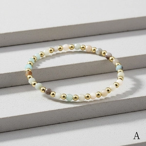 Detail of 4mm faceted amazonite bead bracelet with polished gold plated metal spacers