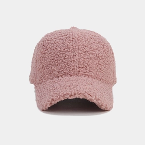 Close-up of the thick pink lamb wool fabric showing its soft and fluffy texture