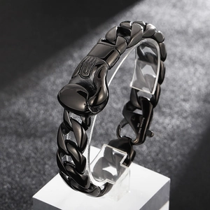 Detail of black stainless steel Cuban chain bracelet with unique boxing glove clasp
