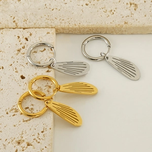 Polished stainless steel hollow wing hoop earrings in gold and silver finish