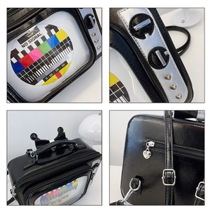 Detailed views of vintage TV-shaped bag featuring silver knobs and heart studs