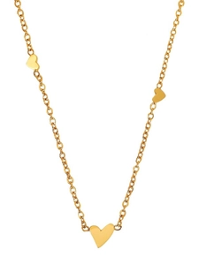 Macro shot of three polished gold heart pendants on a sleek minimalist chain necklace