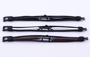 Three woven leather anchor bracelets in black and brown featuring a secure metal clasp