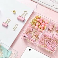 Pink and gold stationery set in a four-grid organizer with binder clips and paperclips