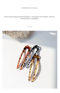 Close-up of three U-shaped resin hair forks with brown and grey leopard patterns