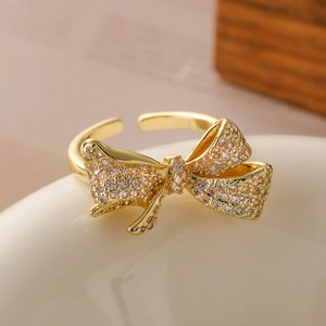 Exquisite 18K gold-plated bow ring with sparkling cubic zirconia in an adjustable open design