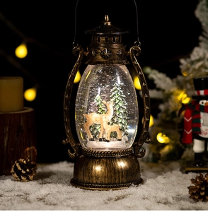 Close-up of vintage bronze Christmas lantern with deer family and swirling snow inside