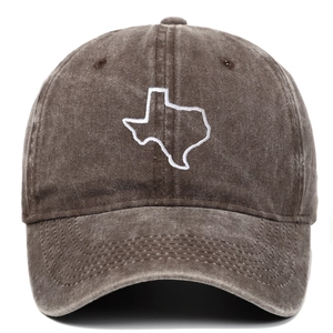 Dettaglio del cotone lavato vintage e del ricamo della mappa del Texas sul cappellino