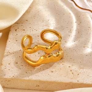 Minimalist double-layered gold wavy line ring on beige travertine with silk