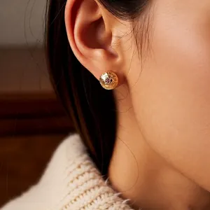 Vintage 18k gold plated round stud earrings with purple gemstone and woven texture detail