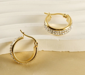 Detail of 18K gold-plated stainless steel hoop earrings with sparkling rhinestones