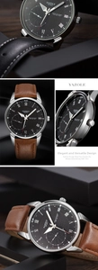 Macro detail of quartz watch dial with Roman numerals and sunburst pattern texture