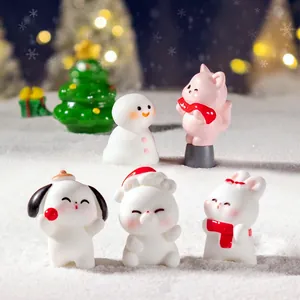 Christmas miniature animal figurines set with snowman puppy and bear in snow scene