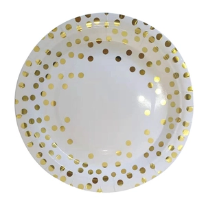 White disposable paper plate with gold foil polka dots for birthday party tableware
