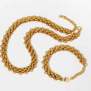 Detailed close-up of heavy braided link chain set with lobster clasp and round logo tag