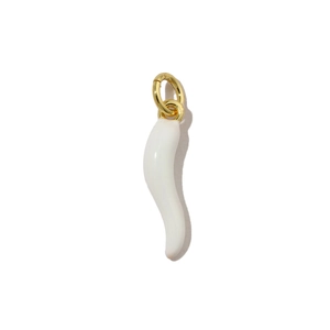 Macro shot of white pepper pendant with gold metal ring for jewelry making