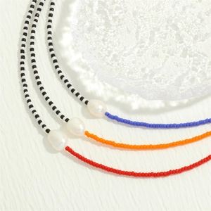 Detailed view of colorful MGB bead necklaces featuring irregular baroque freshwater pearls