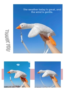 Detail of adjustable strap and metal buckle on a white plush goose shoulder bag