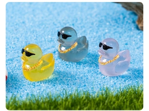 Micro landscape duck figurines with sunglasses and gold chains in colorful resin