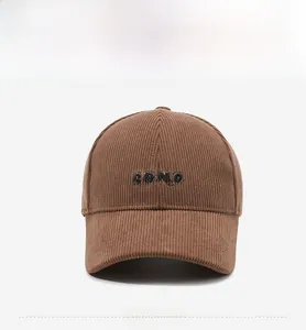 Detailed front view of brown corduroy baseball cap with black SOME 3D embroidery