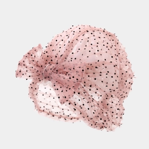Pink mesh baby turban hat with black polka dots and a large decorative bow detail