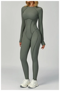 Detail of sage green yoga bodysuit showing contrast stitching and textured stretch fabric