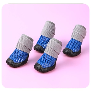 Detail of blue breathable mesh pet shoes with anti-slip rubber soles and elastic cuffs