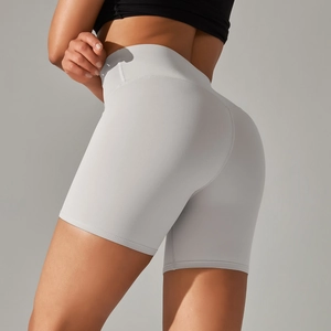 Close-up of light gray high-waisted yoga shorts with seamless butt lifting cut and texture