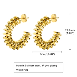 Macro shot showing dimensions and measurements of twisted stainless steel gold earrings