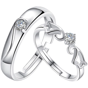 Macro shot of silver plated adjustable couple rings with clear round gemstones