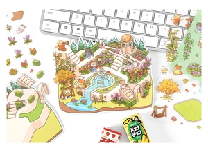 Detailed view of 3D garden stickers and cartoon decals on a grey laptop keyboard