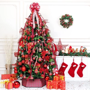 Close-up of red and white Christmas tree ornament set with ribbon and glitter baubles