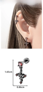 Detail view of gothic snake cross earring with red zircon including size dimensions