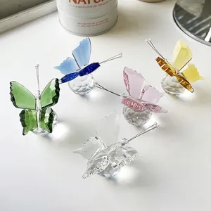 Five crystal butterfly figurines in assorted colors with multifaceted cut glass wings