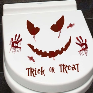 Detail of scary red bloody handprints and face stickers for Halloween toilet seat decor