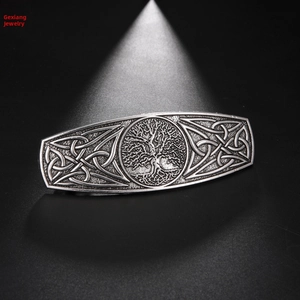 Macro detail of antique silver Tree of Life barrette with Celtic knot metal engraving