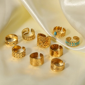 Set of 9 French vintage 18k gold plated stainless steel rings on beige satin