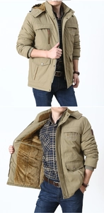 Close-up of khaki hooded jacket featuring warm yellow sherpa lining and zip pockets