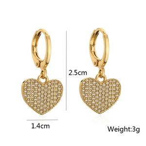 Detail shot of gold heart earrings with zircon inlay showing 2.5cm height and 3g weight