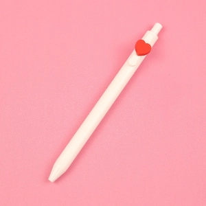 White retractable gel pen featuring a red heart clip on a soft pink background