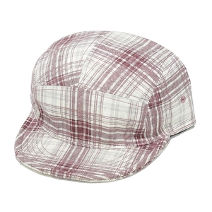 Detail of red and white plaid 5-panel camper hat with flat brim and side eyelets